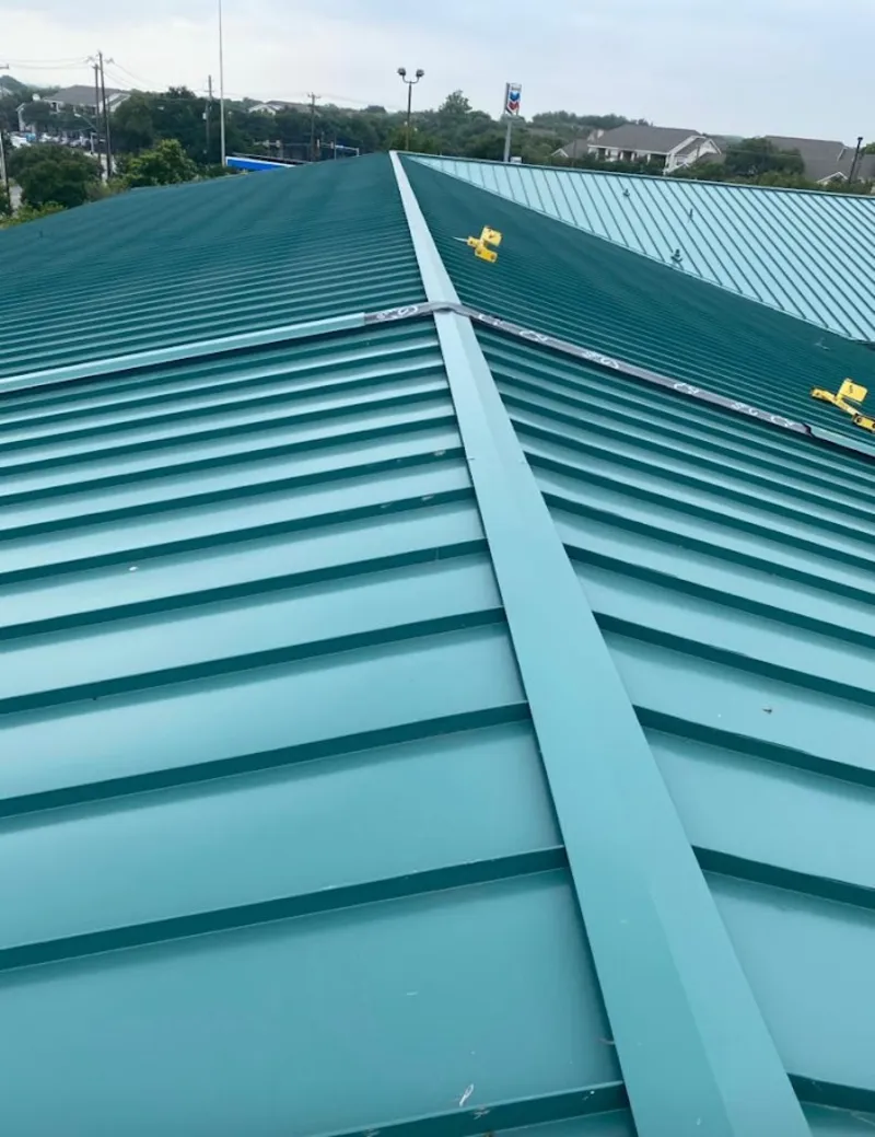 Green commercial metal roof ridge and valley for Metal Roof Repair in Menomonie